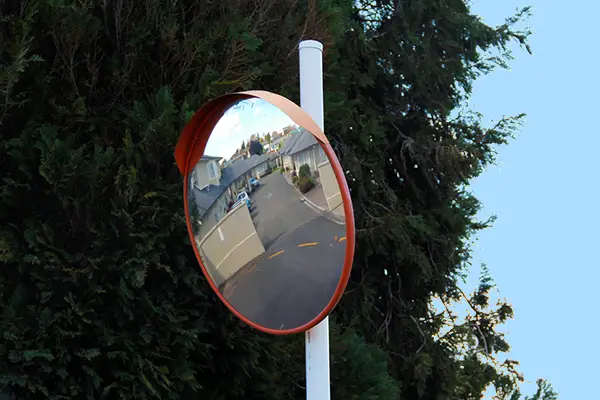 DuraVision Driveway Traffic Mirror installed at an outdoor blind driveway intersection